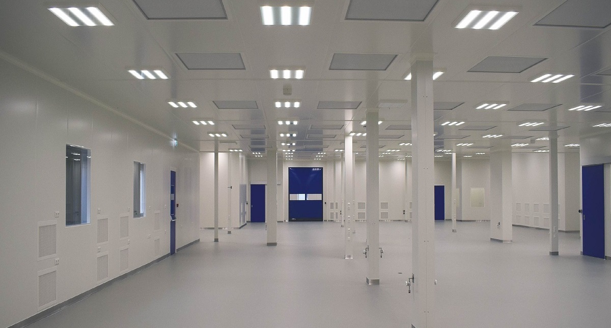 Cleanroom manufacturing area with modular wall panels and ceiling